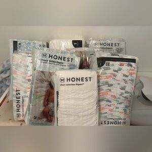 8 packs of size 1 honest diapers. All sealed
